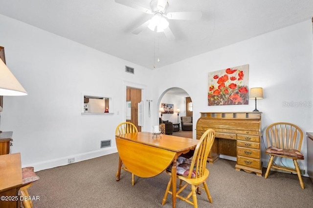 918 N Wild Olive Ave, Daytona Beach, FL 32118 - carpeted dining space featuring a ceiling fan and arched walkways