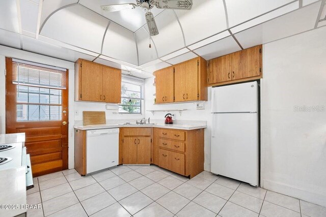 918 N Wild Olive Ave, Daytona Beach, FL 32118 - kitchen featuring white appliances, light countertops, a ceiling fan, and light tile patterned floors