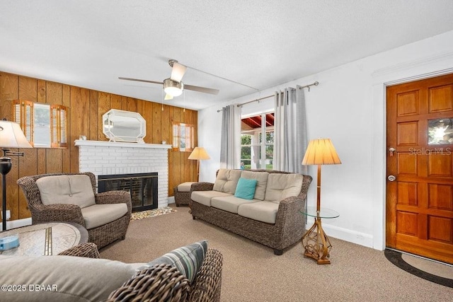 918 N Wild Olive Ave, Daytona Beach, FL 32118 - living area featuring carpet floors, a fireplace, wood walls, and a ceiling fan