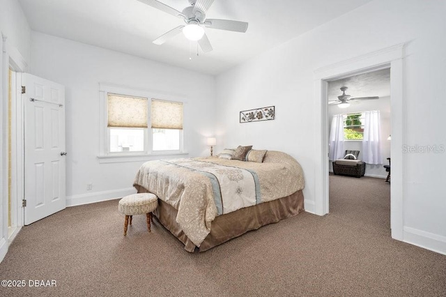 918 N Wild Olive Ave, Daytona Beach, FL 32118 - carpeted bedroom with baseboards and ceiling fan