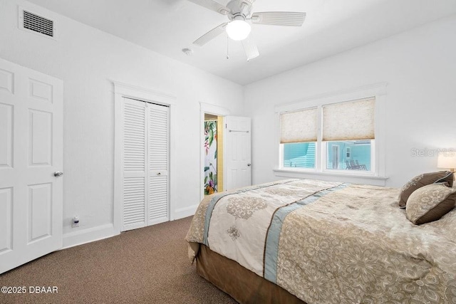 918 N Wild Olive Ave, Daytona Beach, FL 32118 - bedroom with carpet, a closet, and a ceiling fan