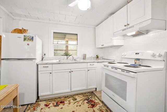 918 N Wild Olive Ave, Daytona Beach, FL 32118 - kitchen featuring white appliances, under cabinet range hood, white cabinetry, and light countertops