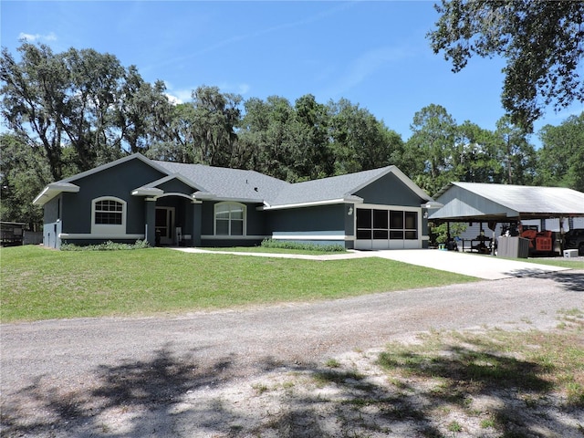 400 S County Road 115, Bunnell, FL 32110 - ranch-style home featuring a front lawn, concrete driveway, and view of scattered trees
