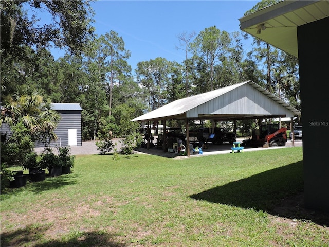 400 S County Road 115, Bunnell, FL 32110 - view of green lawn with a detached carport