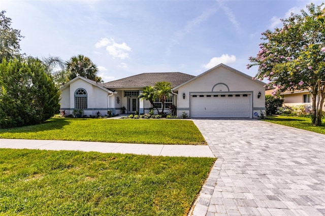 38 Mount Vernon Ln, Palm Coast, FL 32164 - single story home with stucco siding, a front yard, a garage, and decorative driveway