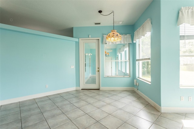 38 Mount Vernon Ln, Palm Coast, FL 32164 - unfurnished dining area with a chandelier and light tile patterned flooring