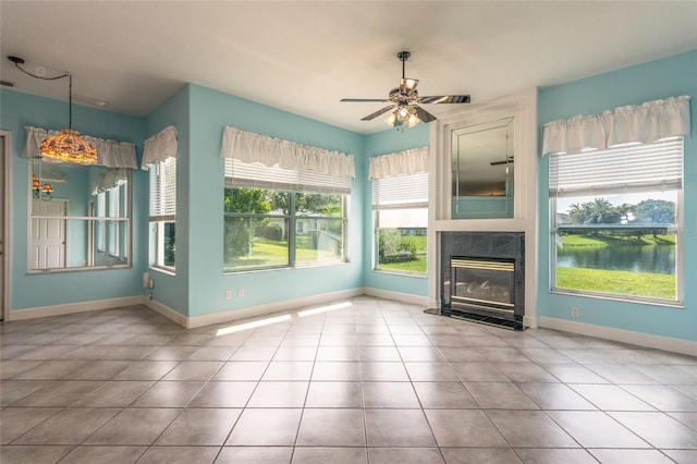 38 Mount Vernon Ln, Palm Coast, FL 32164 - unfurnished living room with tile patterned floors, ceiling fan, and a premium fireplace