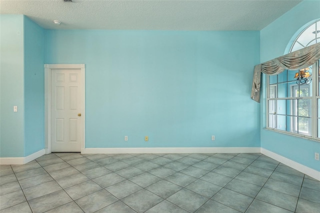 38 Mount Vernon Ln, Palm Coast, FL 32164 - tiled spare room with a textured ceiling