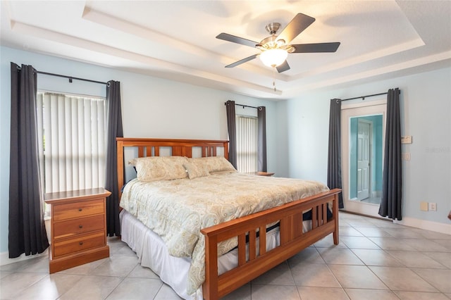 38 Mount Vernon Ln, Palm Coast, FL 32164 - bedroom with a raised ceiling, light tile patterned flooring, and access to outside