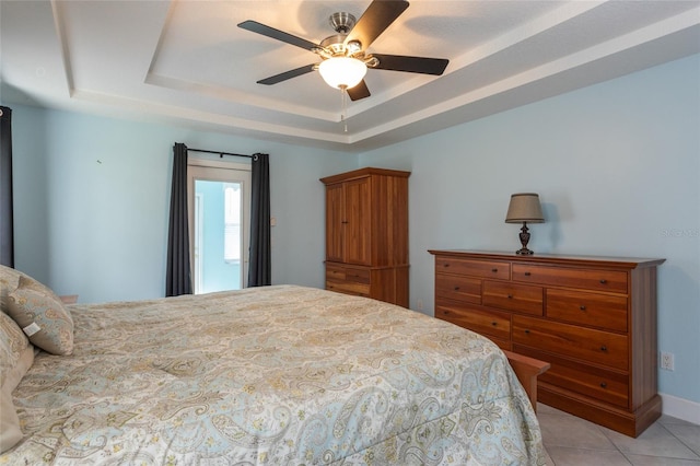 38 Mount Vernon Ln, Palm Coast, FL 32164 - bedroom with a raised ceiling, light tile patterned flooring, and a ceiling fan