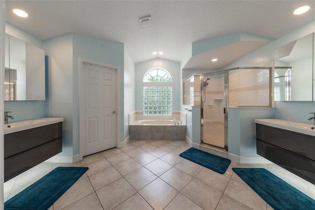 38 Mount Vernon Ln, Palm Coast, FL 32164 - full bath with a garden tub, a stall shower, two vanities, recessed lighting, and tile patterned floors