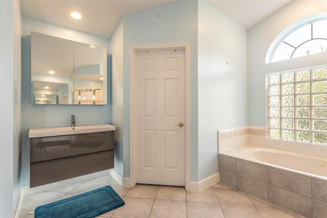 38 Mount Vernon Ln, Palm Coast, FL 32164 - full bathroom with vanity, a garden tub, and tile patterned floors