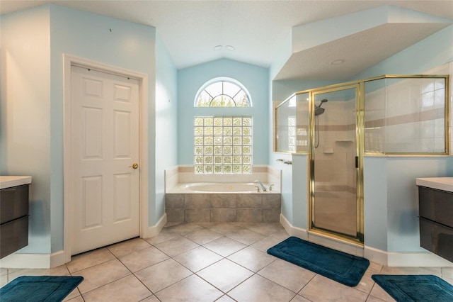 38 Mount Vernon Ln, Palm Coast, FL 32164 - bathroom with a bath, tile patterned flooring, vanity, a shower stall, and lofted ceiling