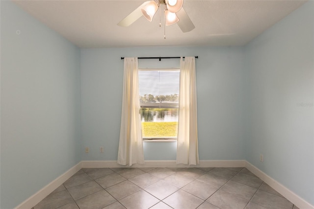 38 Mount Vernon Ln, Palm Coast, FL 32164 - empty room featuring light tile patterned floors and ceiling fan