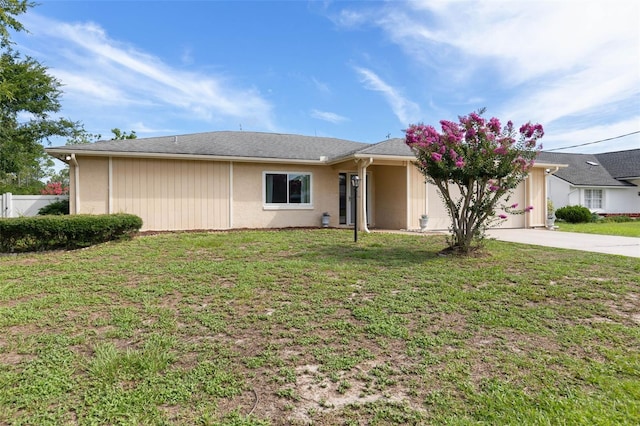 1 Wilson Pl, Palm Coast, FL 32164 - single story home with concrete driveway, a garage, and stucco siding