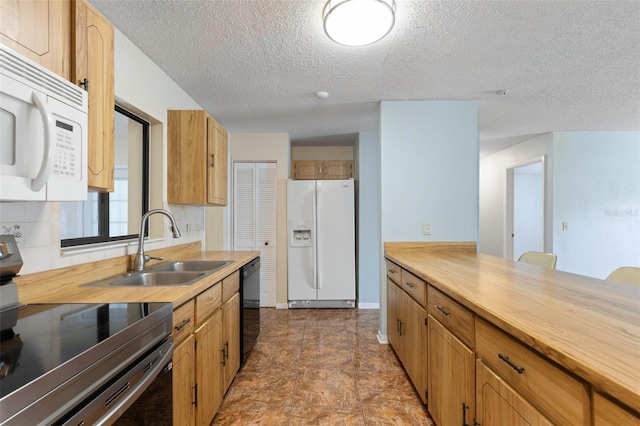 1 Wilson Pl, Palm Coast, FL 32164 - kitchen featuring white appliances, a textured ceiling, and wood counters