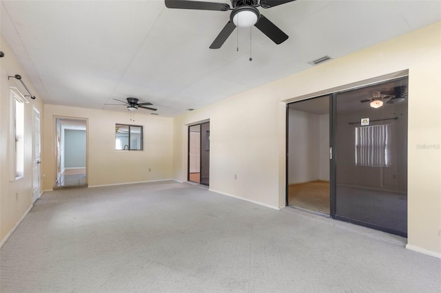 1 Wilson Pl, Palm Coast, FL 32164 - empty room featuring ceiling fan and light carpet