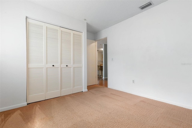 1 Wilson Pl, Palm Coast, FL 32164 - unfurnished bedroom with carpet flooring and a closet