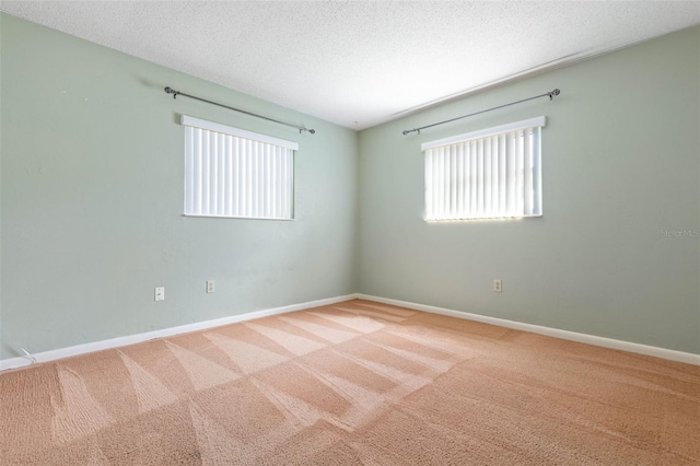 1 Wilson Pl, Palm Coast, FL 32164 - empty room featuring carpet flooring and a textured ceiling