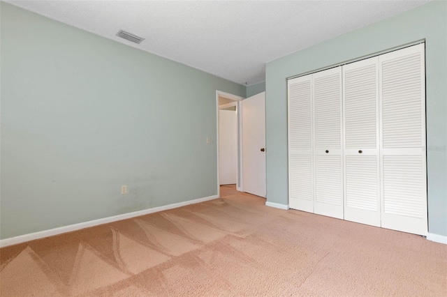 1 Wilson Pl, Palm Coast, FL 32164 - unfurnished bedroom featuring carpet flooring and a closet