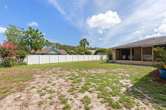 1 Wilson Pl, Palm Coast, FL 32164 - view of yard with a sunroom