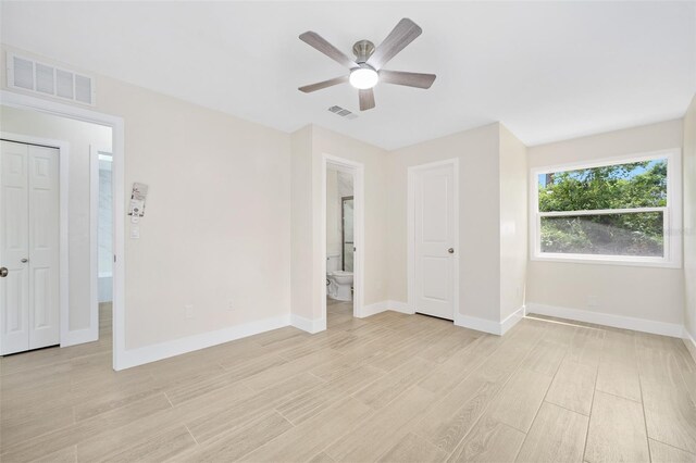 3 Fenwood Ln, Palm Coast, FL 32137 - empty room featuring light wood-style flooring and a ceiling fan