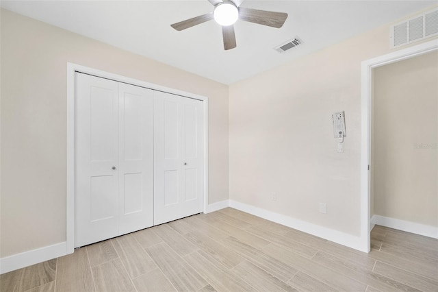 3 Fenwood Ln, Palm Coast, FL 32137 - unfurnished bedroom with light wood-style floors, a closet, and ceiling fan