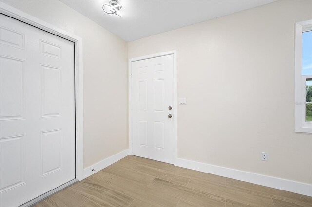 3 Fenwood Ln, Palm Coast, FL 32137 - foyer with light wood-type flooring and baseboards