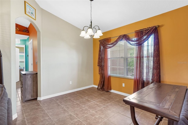 5 Zorlou Ct, Palm Coast, FL 32164 - tiled dining area featuring arched walkways and a chandelier