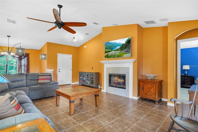 5 Zorlou Ct, Palm Coast, FL 32164 - tiled living room with ceiling fan, a tiled fireplace, and high vaulted ceiling