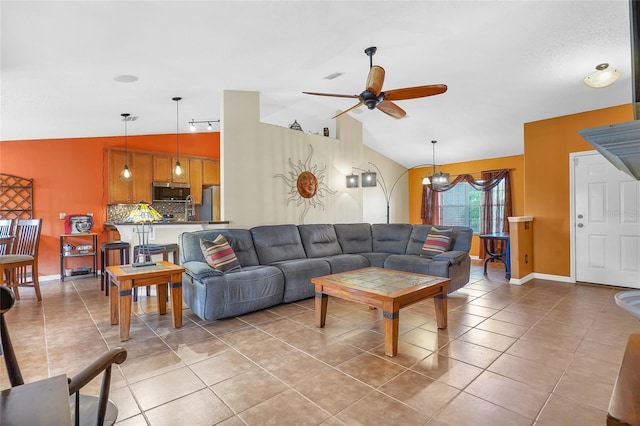 5 Zorlou Ct, Palm Coast, FL 32164 - living room featuring lofted ceiling, a ceiling fan, and light tile patterned floors