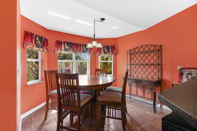 5 Zorlou Ct, Palm Coast, FL 32164 - tiled dining space with a chandelier and baseboards
