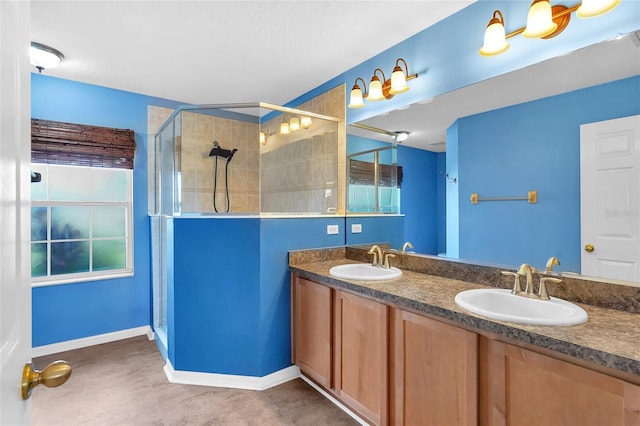 5 Zorlou Ct, Palm Coast, FL 32164 - full bathroom with a shower stall, double vanity, and a textured ceiling