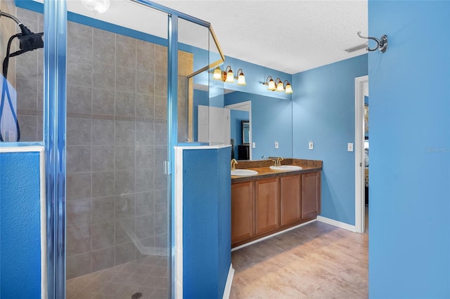 5 Zorlou Ct, Palm Coast, FL 32164 - full bathroom with a stall shower, a textured ceiling, and double vanity