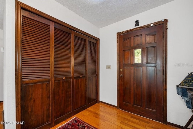 1108 Northside Dr, Ormond Beach, FL 32174 - foyer entrance with light wood-type flooring and a textured ceiling
