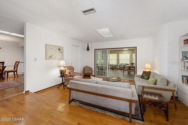 1108 Northside Dr, Ormond Beach, FL 32174 - living area with light wood-style floors and baseboards