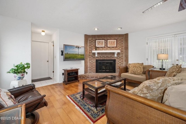 1108 Northside Dr, Ormond Beach, FL 32174 - living area with light wood finished floors, recessed lighting, and a brick fireplace