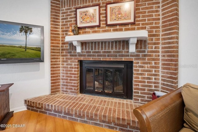 1108 Northside Dr, Ormond Beach, FL 32174 - detailed view of wood finished floors and a fireplace