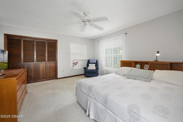 1108 Northside Dr, Ormond Beach, FL 32174 - bedroom featuring light carpet and a ceiling fan