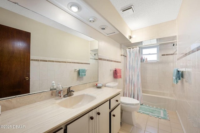 1108 Northside Dr, Ormond Beach, FL 32174 - bathroom with tile walls, vanity, shower / bath combo with shower curtain, tile patterned floors, and wainscoting