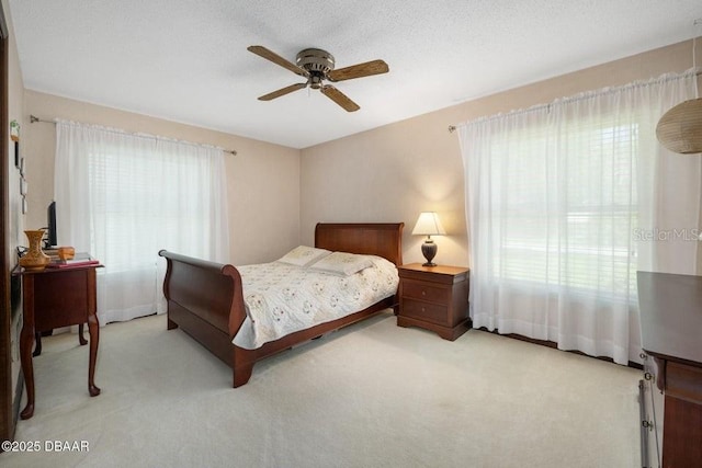 1108 Northside Dr, Ormond Beach, FL 32174 - bedroom with light carpet and a ceiling fan