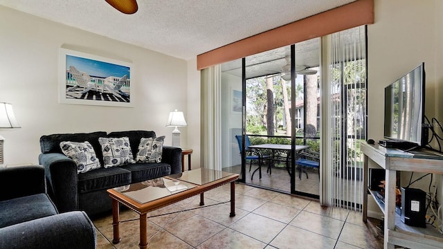 4655 46th Street Ct W Unit 101, Bradenton, FL 34210 - living room featuring light tile patterned floors and a textured ceiling
