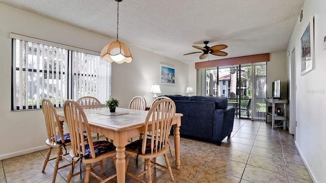 4655 46th Street Ct W Unit 101, Bradenton, FL 34210 - dining space with a textured ceiling, a ceiling fan, and light tile patterned flooring