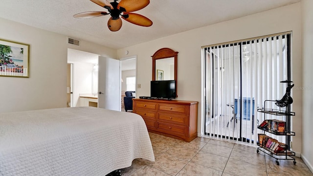 4655 46th Street Ct W Unit 101, Bradenton, FL 34210 - bedroom featuring multiple windows, light tile patterned floors, and ceiling fan