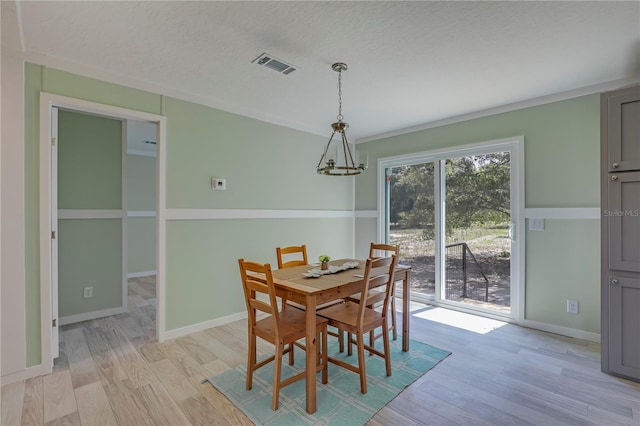 606 Ofarrell Ave, Interlachen, FL 32148 - dining room featuring light wood-style floors and a textured ceiling
