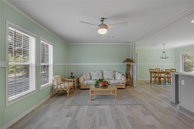 606 Ofarrell Ave, Interlachen, FL 32148 - living room featuring wood finished floors, a ceiling fan, and crown molding