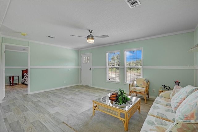 606 Ofarrell Ave, Interlachen, FL 32148 - living room with ornamental molding, a ceiling fan, and wood finished floors