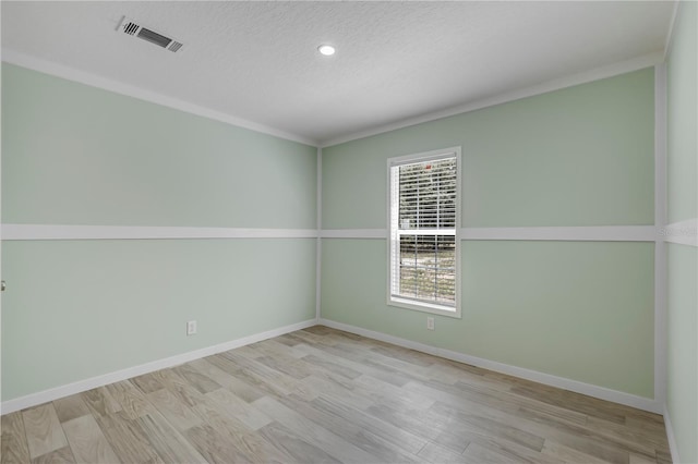 606 Ofarrell Ave, Interlachen, FL 32148 - spare room featuring wood finished floors, a textured ceiling, and recessed lighting