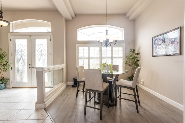 7 Lewis Shire Way, Palm Coast, FL 32137 - dining space featuring a chandelier, light wood finished floors, and beam ceiling