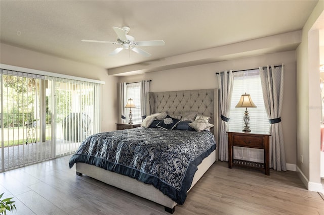 7 Lewis Shire Way, Palm Coast, FL 32137 - bedroom with access to outside, wood finished floors, multiple windows, and ceiling fan
